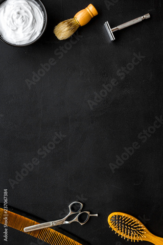 Instruments of male hairdresser barbershop top view on dark background mockup