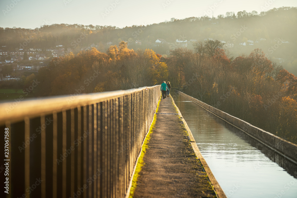 Pontcysyllte Aqueduct is a navigable aqueduct that carries the Llangollen Canal across the River Dee in the Vale of Llangollen in north east Wales, UK. Autumn Scenery