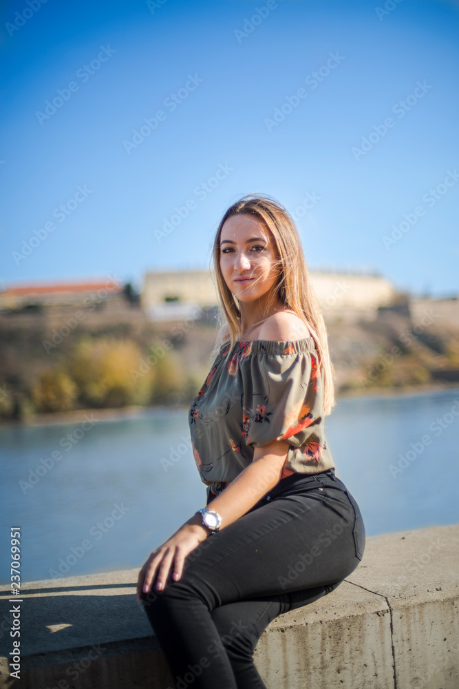 Photographing a girl during autumn with a blurred background Photographing a girl during autumn with a blurred background