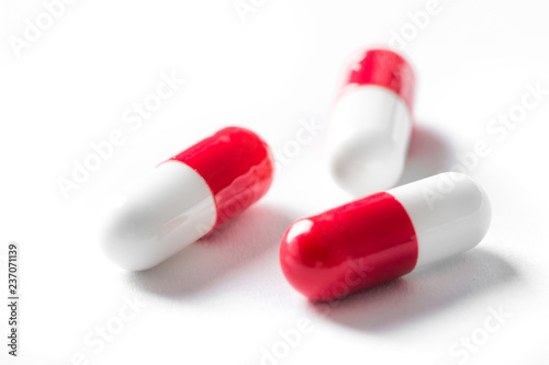 Pharmacy theme, white and red medicine tablets antibiotic pills.