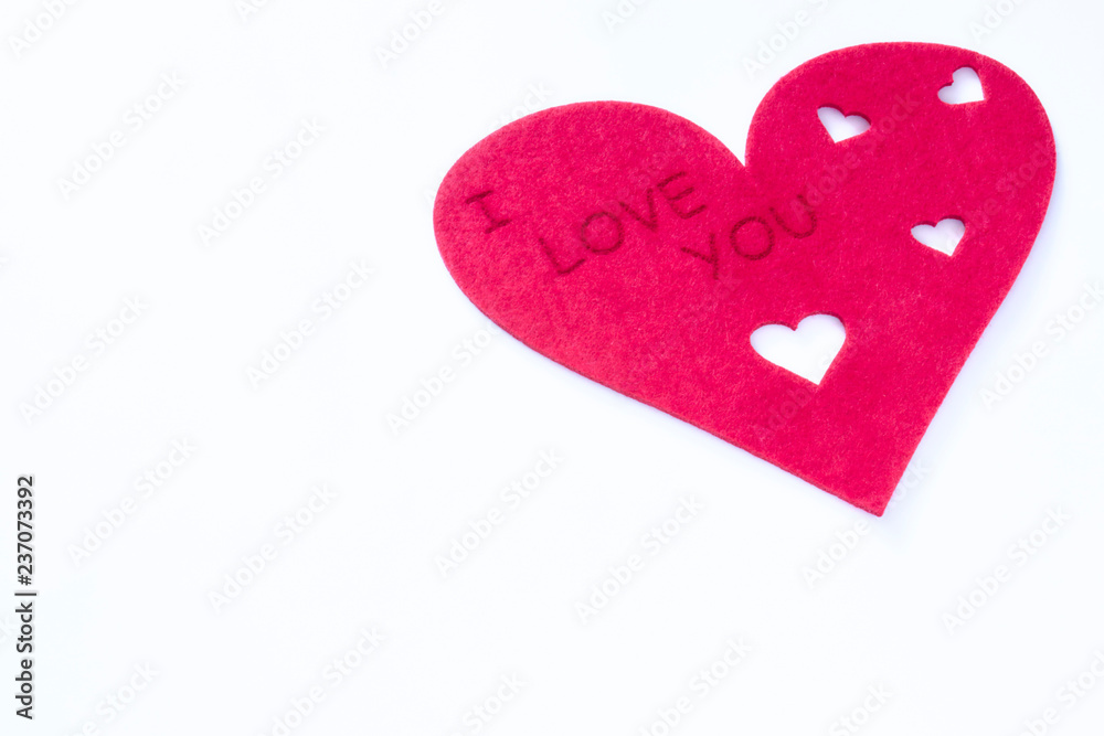 Fototapeta premium scattered red hearts on a white background. Excellent background to the day of Saint Valentine.copy space