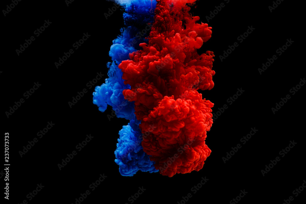 Mix of colored ink in water creating abstract shape, isolated on black  background. Two paints blue red mixing together in water Stock Photo |  Adobe Stock