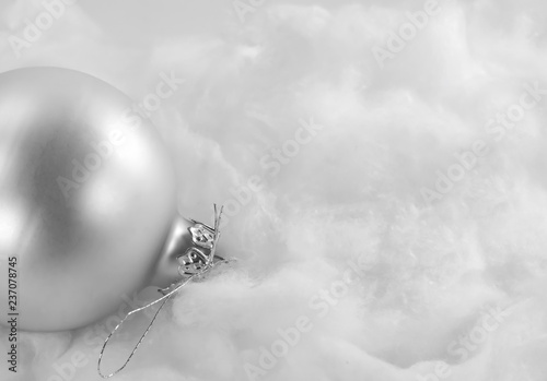 silver xmas ornaments on bright holiday background with space for text. Merry christmas! Happu New Year. photo