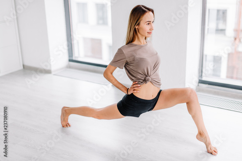 sportswoman training core muscles, balance, cardio and stability. fitness. health care concept. side view full length photo