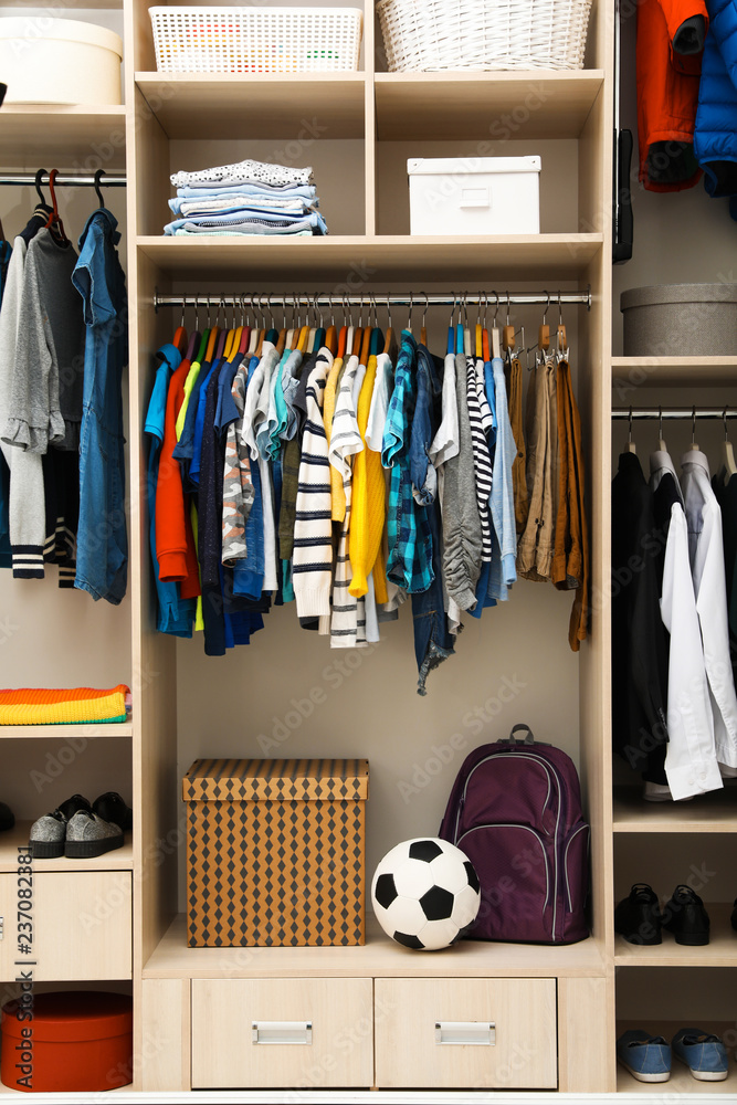 Fototapeta premium Large wardrobe with teenager clothes, shoes and accessories