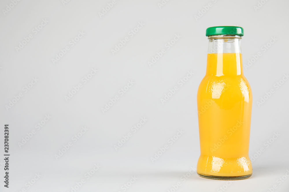 One bottle with tasty drink on color background. Space for text One bottle with tasty drink on color background. Space for text