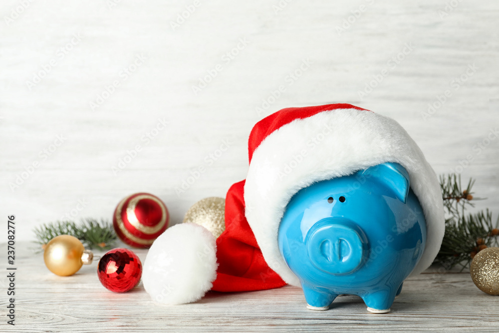 custom made wallpaper toronto digitalComposition with piggy bank and Christmas decor on table. Space for text