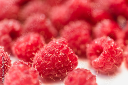 Background texture of dripping raspberry.