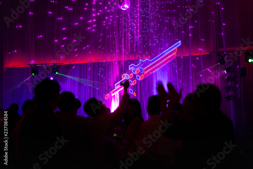 Blurred concept at concert party with audience and colourful led lighting. © bignai