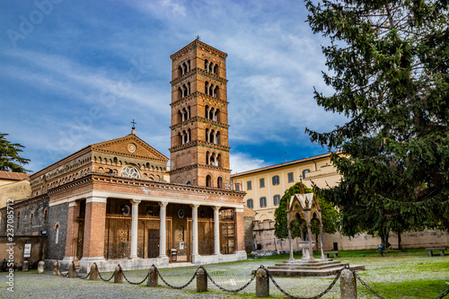The church, the bell tower, and the liturgical fountain 