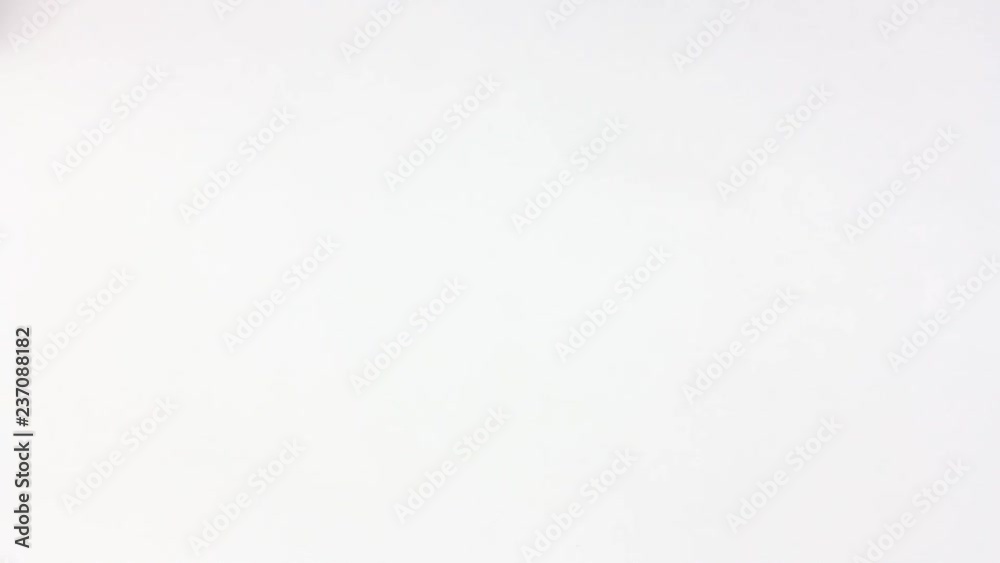 man hits the white table with his fist and squeezes it hard, closeup 