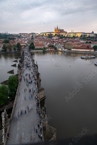 Prague, Czech Republic. Charles Bridge and Hradcany (Prague Castle) with St. Vitus Cathedral and St. George church evening dusk, Bohemia landmark in Praha.