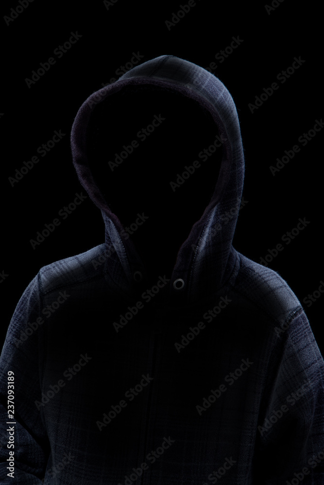 Mysterious Man in Hoodie Silhouette isolated on Black Background Stock  Photo | Adobe Stock
