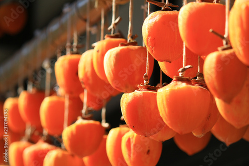 Tableau sur toile Japan's countryside scenery hanging dried persimmons in the eaves of the house