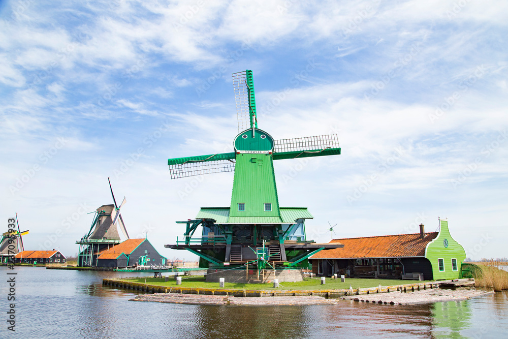 Landscape of well-preserved historic windmills and houses