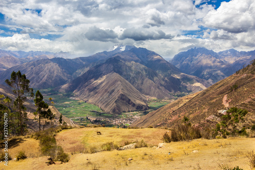 Views over the mountains and rainforest around Machu Picchu citadel. An amazing and idyllic view of the Inca trail and the sacred valley surrounded by a rugged landscape on a cloudy day 