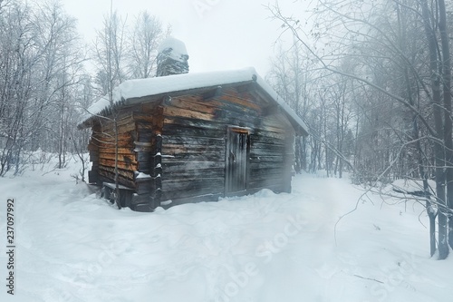 Winter Snowy Landscape with Log Cabin photo