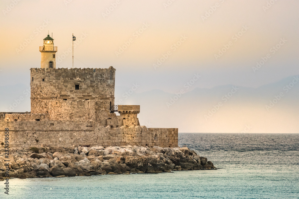 The lighthouse at Mandraki Harbour, Rhodes, Greece.