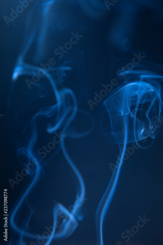 Abstract blue smoke swirls