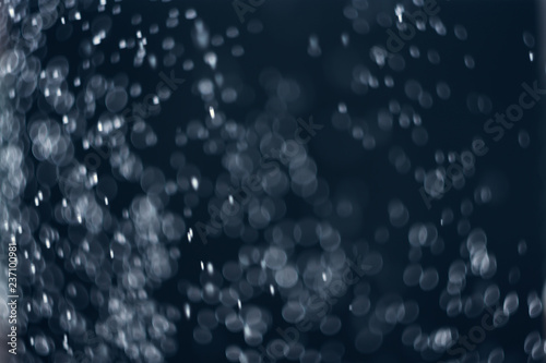 falling snow, abstract blue bokeh background