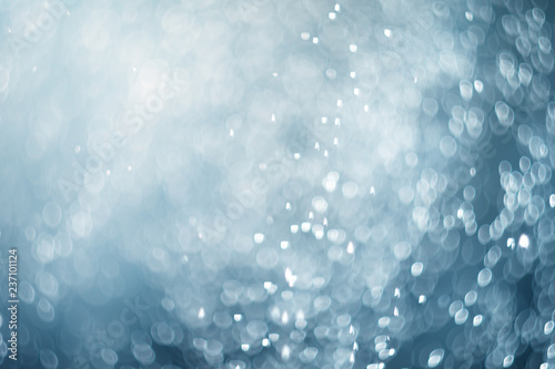 falling snow, abstract blue bokeh background