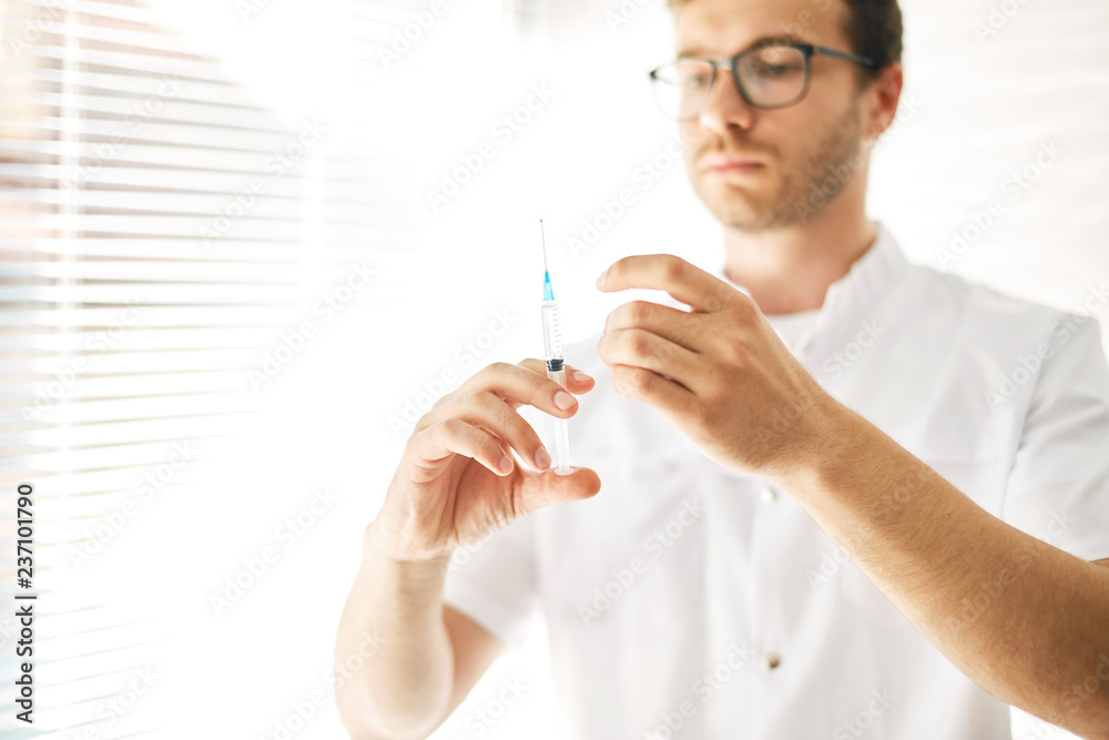 man carring out a vaccination of the population. close up photo. man carring out a vaccination of the population. close up photo.
