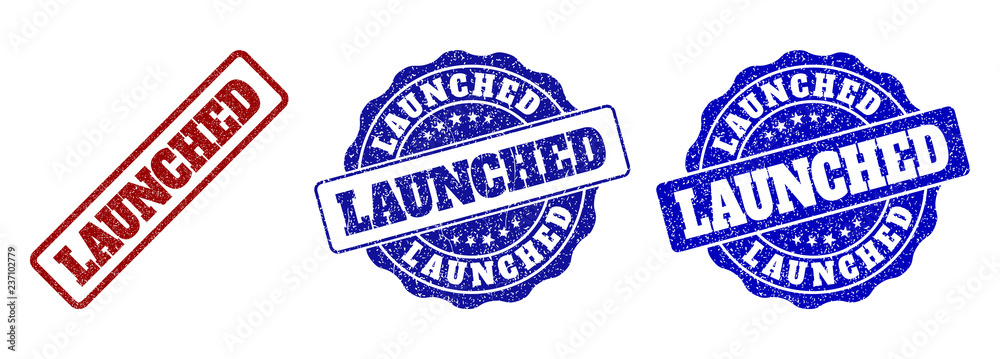 Obraz premium LAUNCHED grunge stamp seals in red and blue colors. Vector LAUNCHED labels with grunge surface. Graphic elements are rounded rectangles, rosettes, circles and text captions.