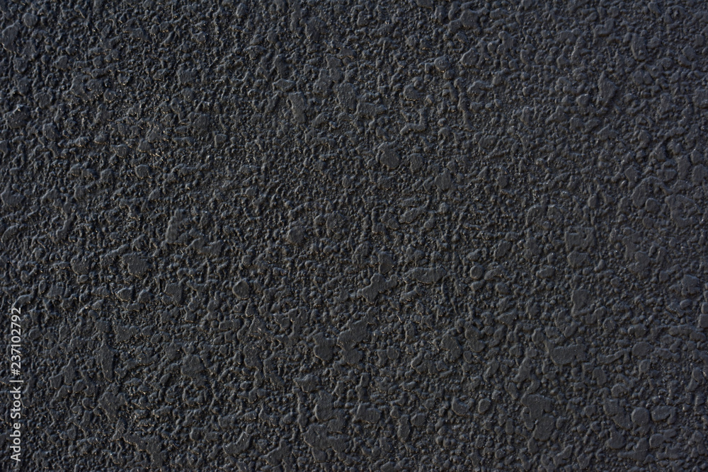 Fototapeta premium Rough black cement plastered wall texture