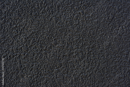 Rough black cement plastered wall texture