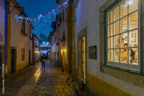 OBIDOS, PORTUGAL - NOVEMBER 20, 2018: Night view of the small streets of the village of Obidos, Portugal