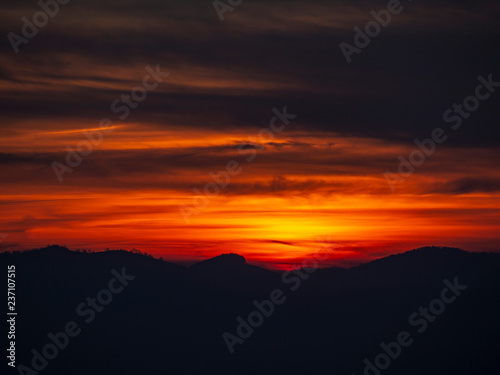 Fiery sunset from mountain peak in a cloudy evening. Fall season. Orobie mountains. Italian Alps © Matteo Ceruti