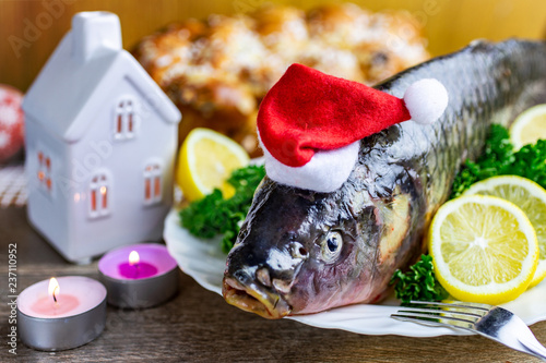 Czech christmas time and customs - bohemian cuisine and typical fish - traditional carp prepared for festive dinner cooking photo