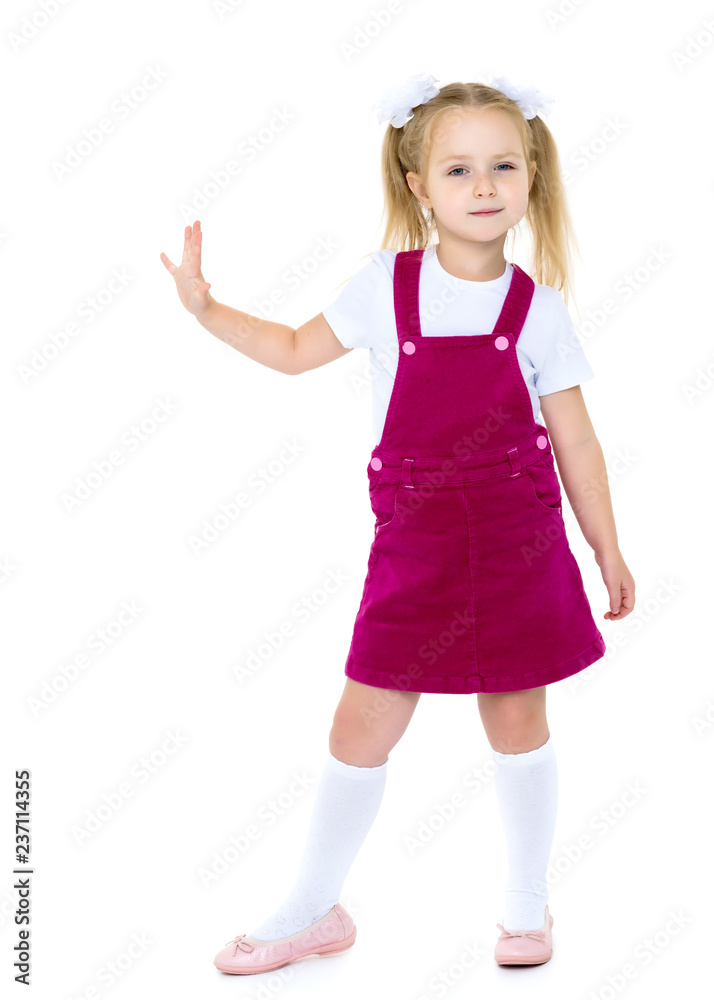Naklejka premium Little girl posing in studio on a white background.