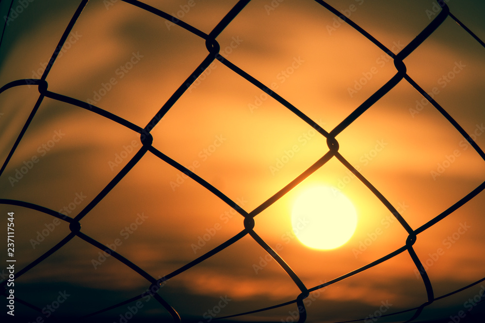 mesh fence with the sun set mesh fence with the sun set