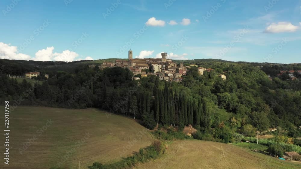Aerial, a beautiful view on a little medieval town in Tuscany, Italy on a sunny day Aerial, a beautiful view on a little medieval town in Tuscany, Italy on a sunny day