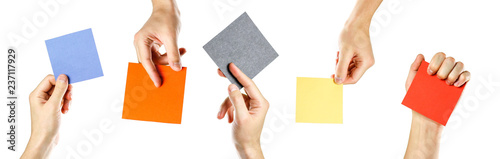 Fotografie Hands holding square blank colored paper