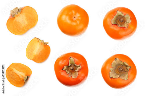 fresh ripe persimmons with slices isolated on white background. top view