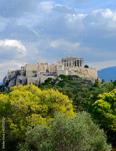 Greece, Acropolis of Athens under blue cloudy sky, view from Pnyx hill
