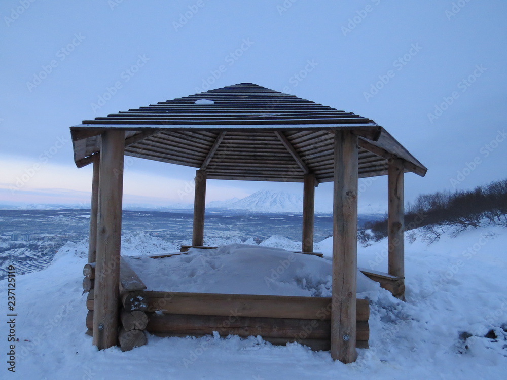 Wooden gazebo on the mountain on a winter day Wooden gazebo on the mountain on a winter day