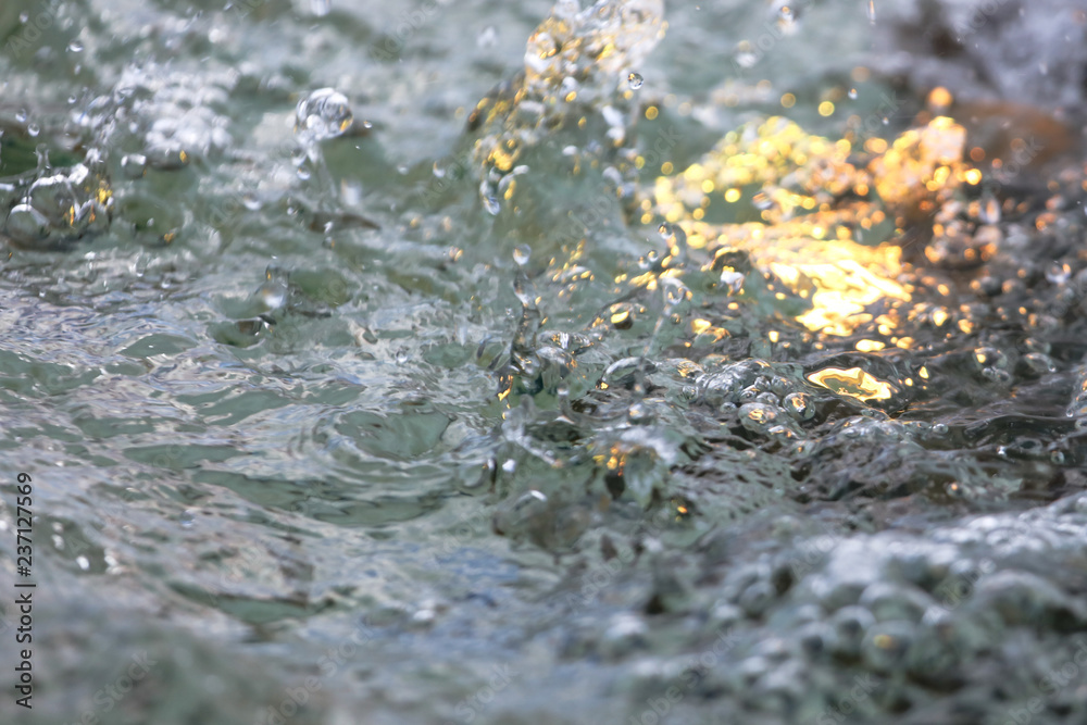 Yellow water in the fountain as abstract background Yellow water in the fountain as abstract background