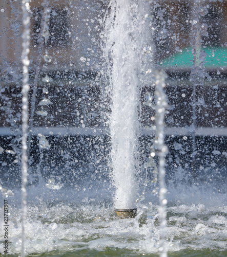 Splashes of water in the fountain in the park