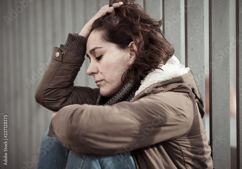 Young attractive woman crying suffering from depression sitting © SB Arts Media