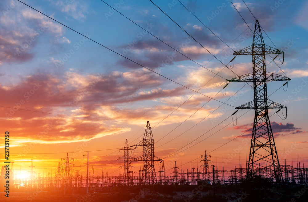 Fototapeta premium High-voltage power lines. Electricity distribution station. high voltage electric transmission tower. Distribution electric substation with power lines and transformers