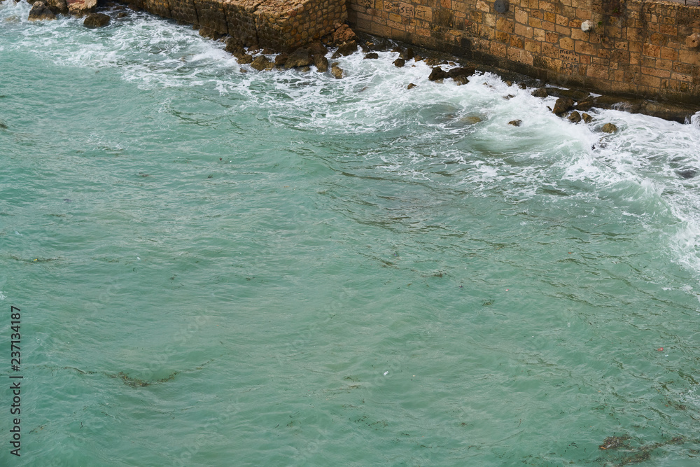 Obraz premium Waves and Rocks Background