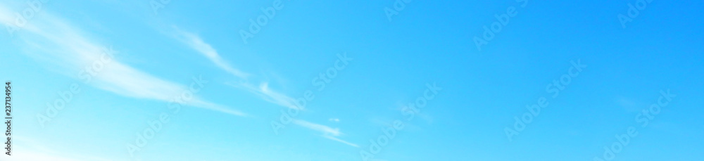 Beautiful blue sky with white fluffy clouds background. Turquoise color blured photography