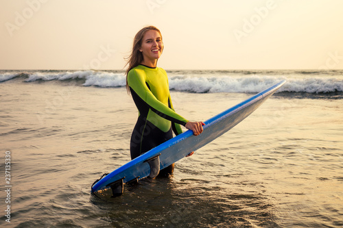 Photography active women with surf board enjoy watersport at vacation holidays