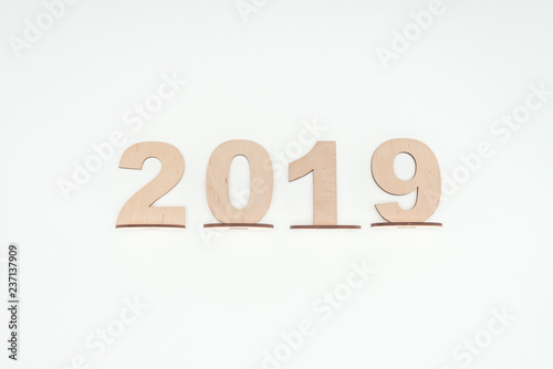 top view of wooden numbers with 2019 date isolated on white