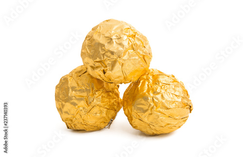 chocolate candy in golden foil isolated