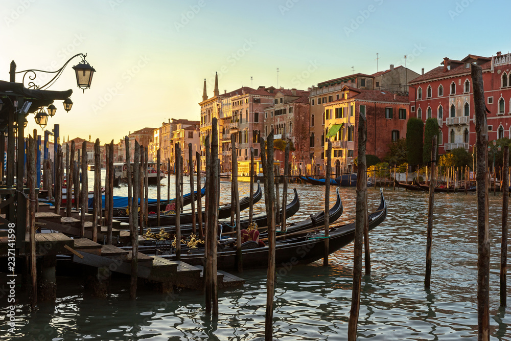Beautiful view of Venice in the sunset sunlight.Venetian houses and gondolas at sunset.