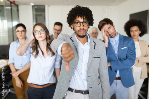 Φωτογραφία Group of unsuccessful business people and badly managed company leads to unhappi